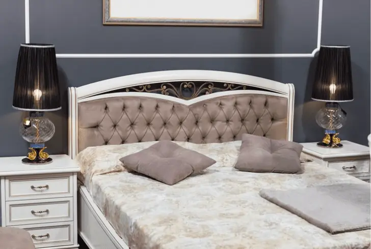 how to make a bed look luxurious - Invest in a Statement Headboard